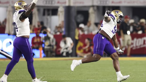 Zion Tupuola-Fetui and Jayvon Parker celebrate a big win at USC.